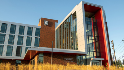 WSU Everett campus building with wheat in foreground